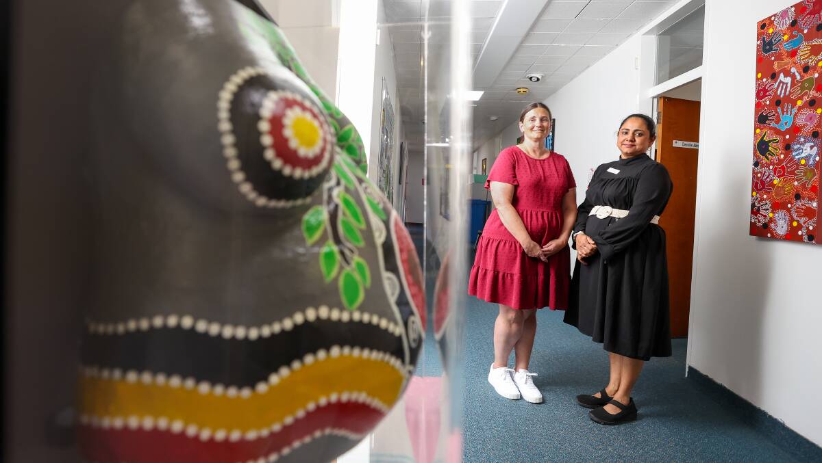 Midwife Tamara Blanch and social worker Julie Wilson standing next to a belly cast, at Binji and Boori. Picture by Adam McLean