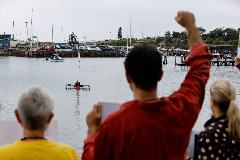 Supporters calling for climate action watched Tom Hunt and Simon Leslie on their kayak as they started their 400km journey to Newcastle. Picture by Anna Warr