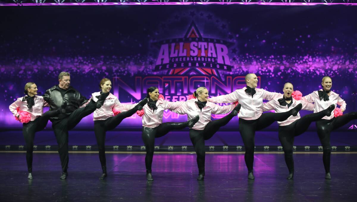 Wollongong lawyer Graham Lancaster, second from left, performing at the Australian All star Cheerleading Federation national championships. Picture supplied.
