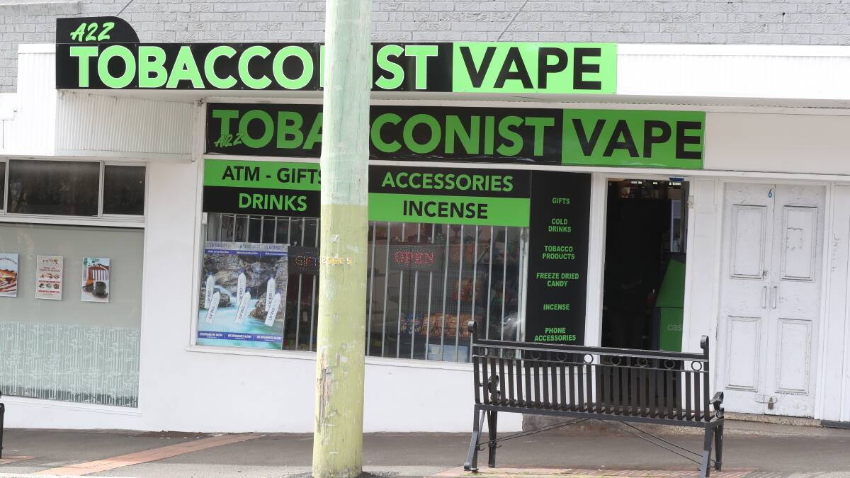 Stores like this in Cringila have not yet removed their vape signage, but the products are now banned from being sold outside pharmacies. Picture by Robert Peet
