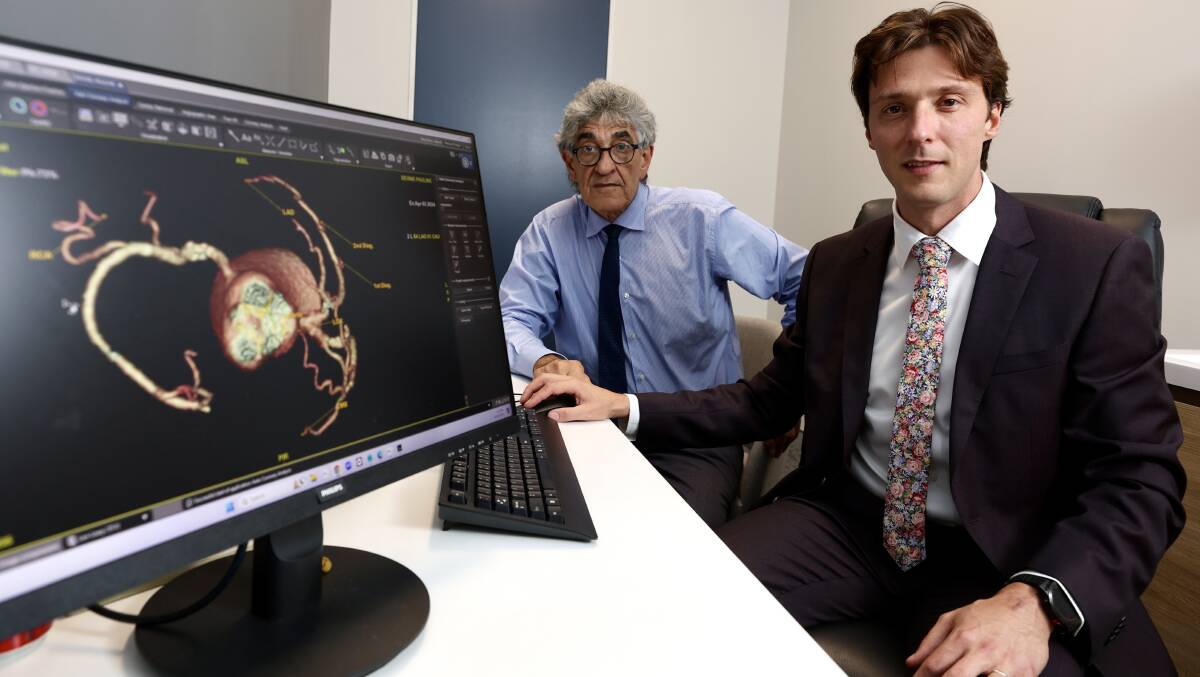 Associate Professor Barry Ellison and cardiologist Dr Jorge Moragues demostrate the use of the new AI heart disease detection tool. Picture by Adam McLean