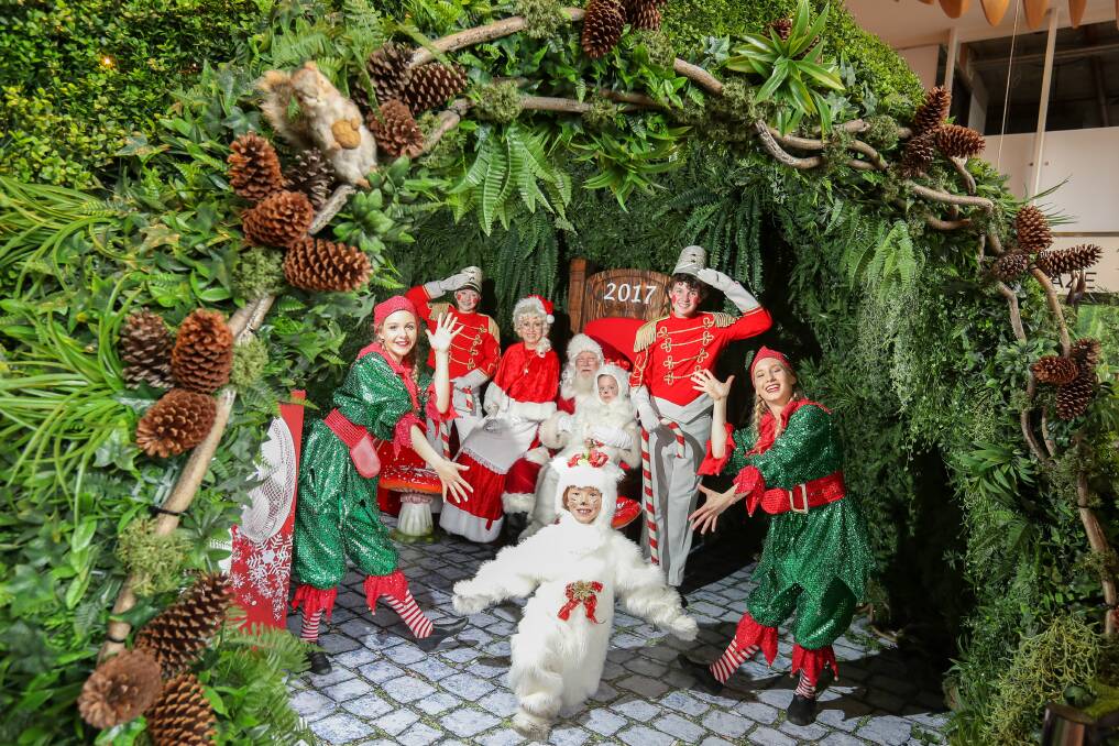 'Tis the season: Santa was joined by numerous elves and other helpers as he moved into to his new Wollongong Central grotto for the festive season. Picture: Adam McLean.