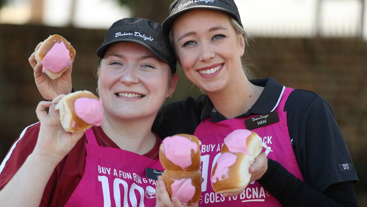 Emmah Freeman and Sarah King from Dapto's Bakers Delight, which has raised the most money so far for the Pink Bun Challenge. Picture by Robert Peet
