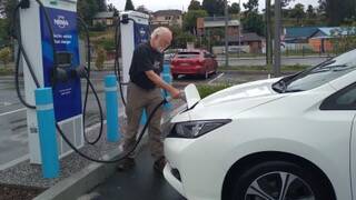 A man at an EV charging station. Picture supplied.