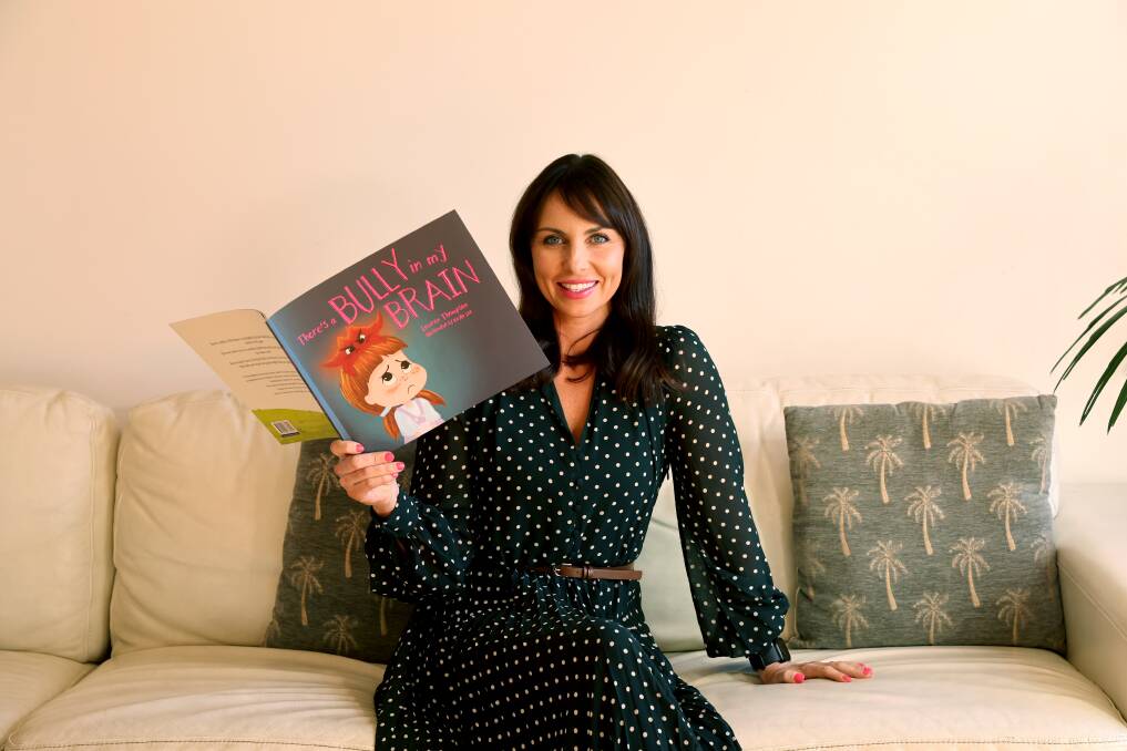 First-time author Lauren Thompson with her new children's book "There's a Bully in my in my Brain". Picture by Sylvia Liber.