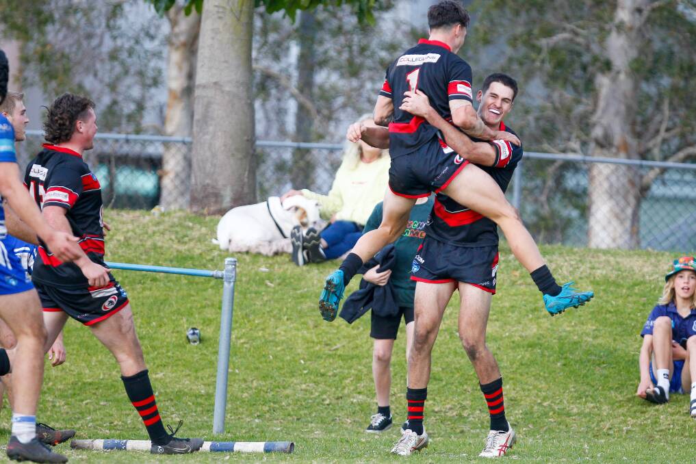 Collegians celebrate Toby Rumble's try against Thirroul on Saturday. Picture by Adam McLean