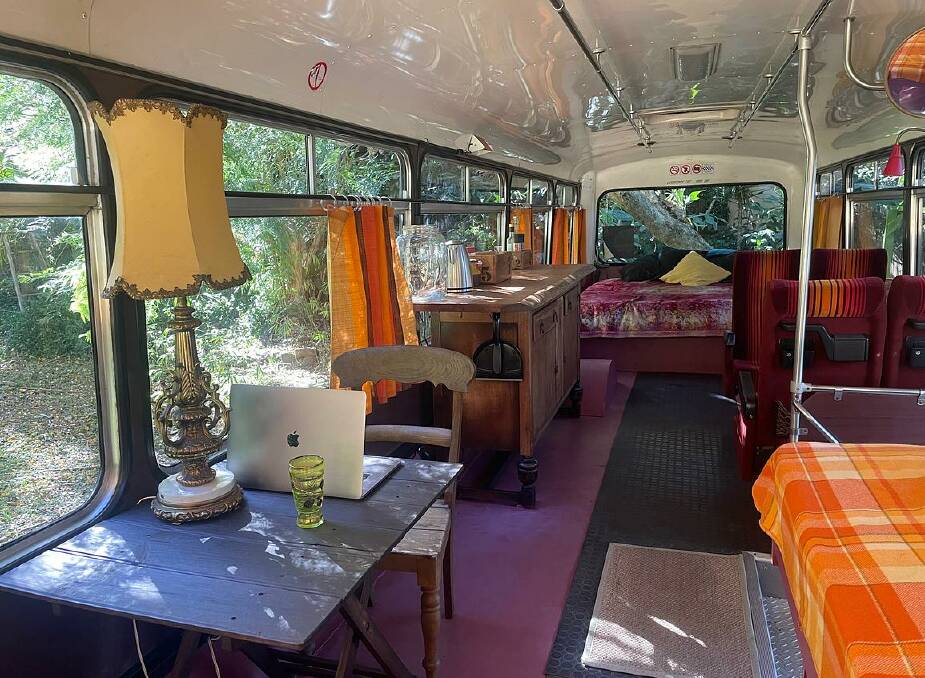 The converted interior of the bus includes a kitchenette, king-sized bed, two stackable beds and dining area. Picture: supplied