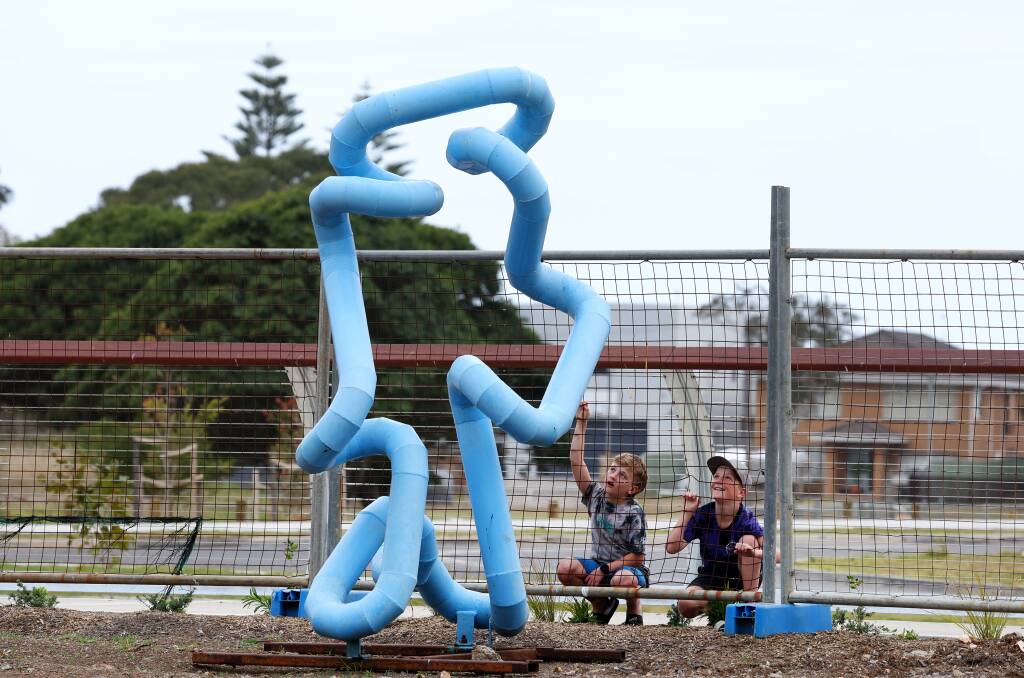 Twins Dean and Curtis Lofty, 11, inspect the mystery sculpture on Tuesday, September 26. Picture: Sylvia Liber 