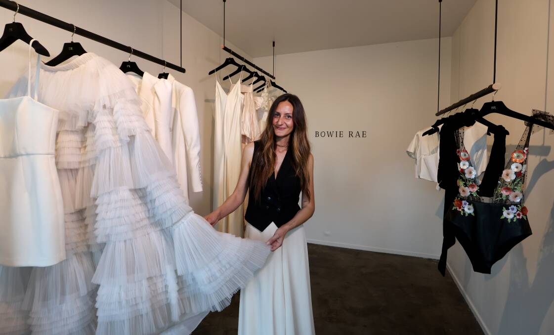 Bowie Rae designer Manal Waugh handles a tulle skirt hanging in her newly-opened Woonona studio on August 3, 2023. Picture by Sylvia Liber 