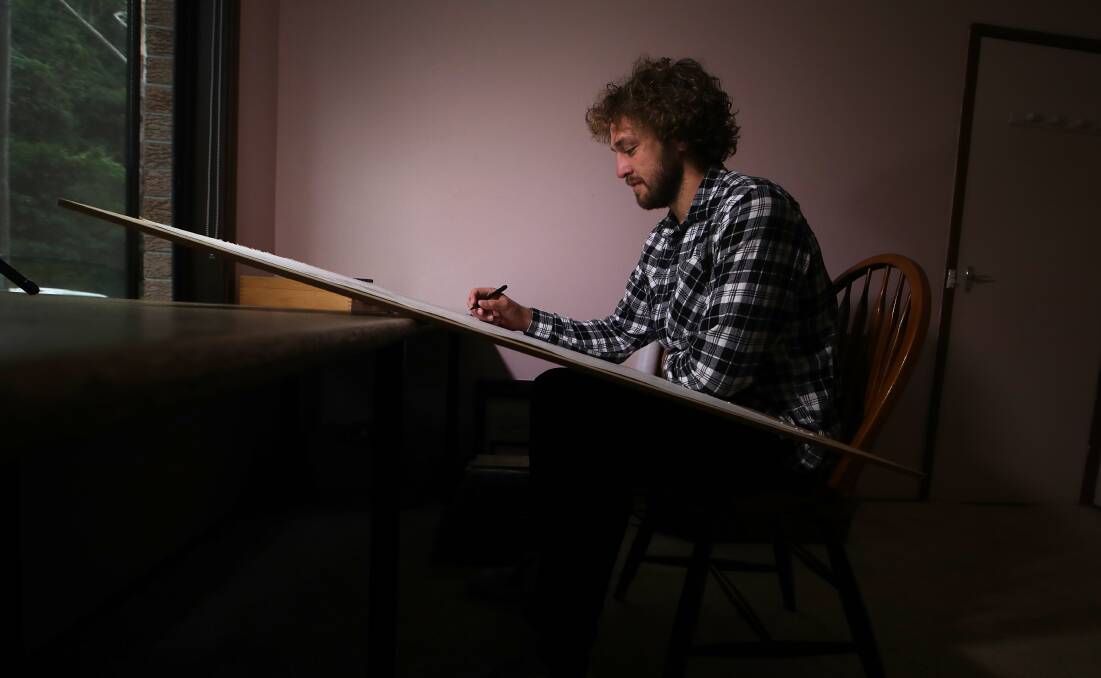 Alex Pescud is pictured working on The Wollongong Map at his Thirroul home in February, 2023. Picture: Sylvia Liber 