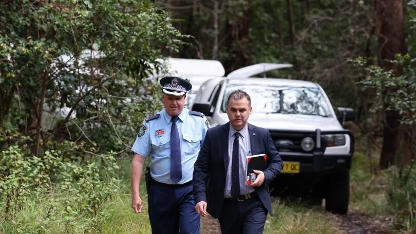 Detective Chief Inspector Glen Broadhead (left) departs the dig site with another detective on Thursday, September 28. Picture: Sylvia Liber 