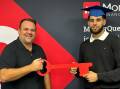 Dino Di Donato, owner of MoneyQuest Wollongong with UOW graduate James Andraos. Picture supplied