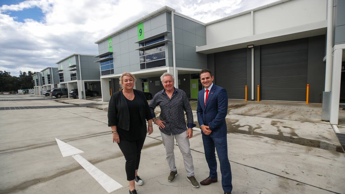 Former motorcycle champion Wayne Gardner (centre) with Travis Machan from MMJ (right) and project manager Lisa Shephard (left) at Wayne's industrial unit project in Bellambi in March 2021. Picture by Adam McLean