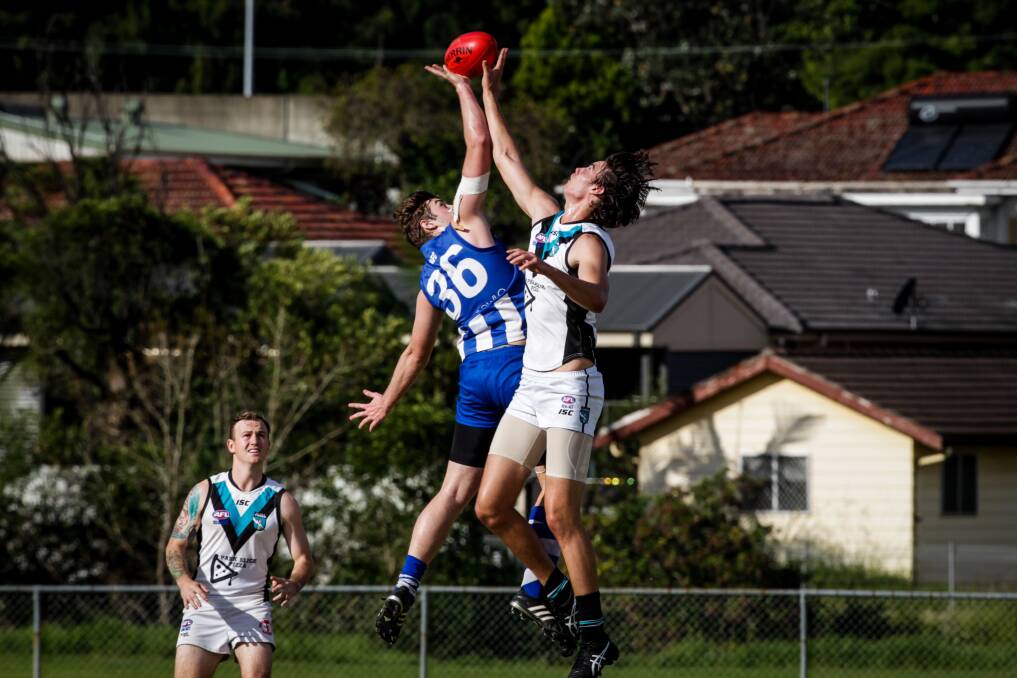 Battle: Figtree's Jordan Humphreys (left), in the ruck against Kiama last year, kicked two goals in the victory over Northern Districts. Picture: Georgia Matts