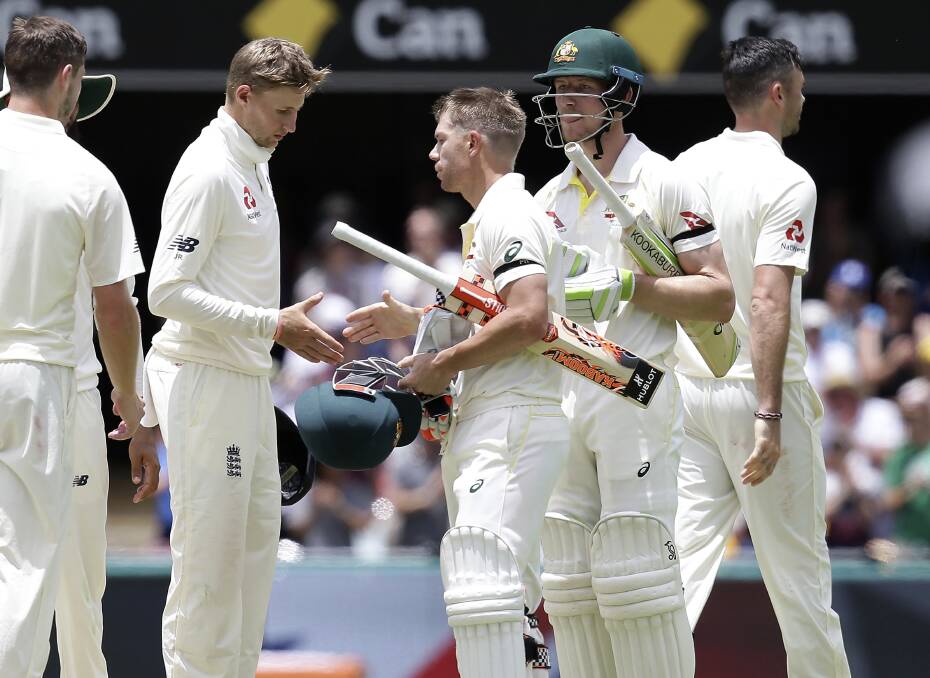 One-nil: Australia's David Warner, center, and Cameron Bancroft, second from right, shake hands with England captain Joe Root. Picture: AP Photo/Tertius Pickard