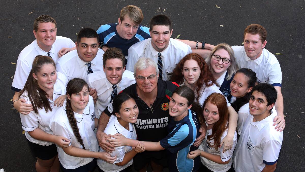 KIT RIDES OFF: Illawarra Sports High School teacher Kit Cullen with students. Mr Cullen has retired after 34 years. Picture: Robert Peet