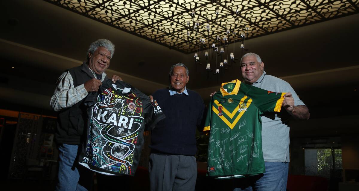 HONOUR: Indigenous rugby league great Bruce Olive (centre) with sons Gary (left) and Darren with the Australian Test and Indigenous All-Stars jumpers. Picture: Adam McLean.