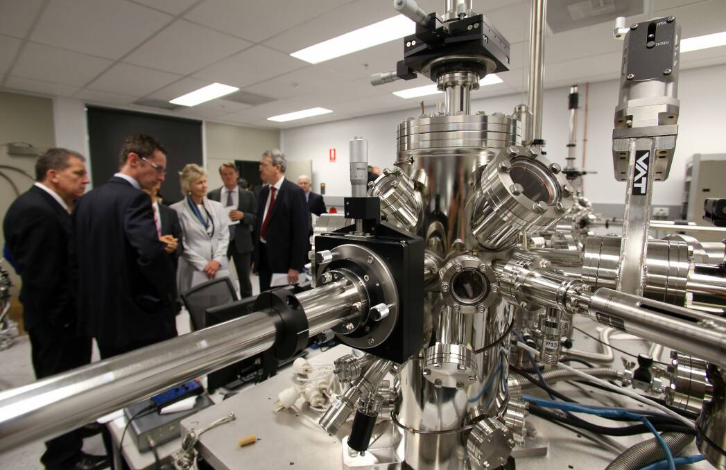 The Australian Institute for Innovative Materials building was opened by science and tertiary education minister Chris Evans (left) in 2012. Picture by Adam McLean.