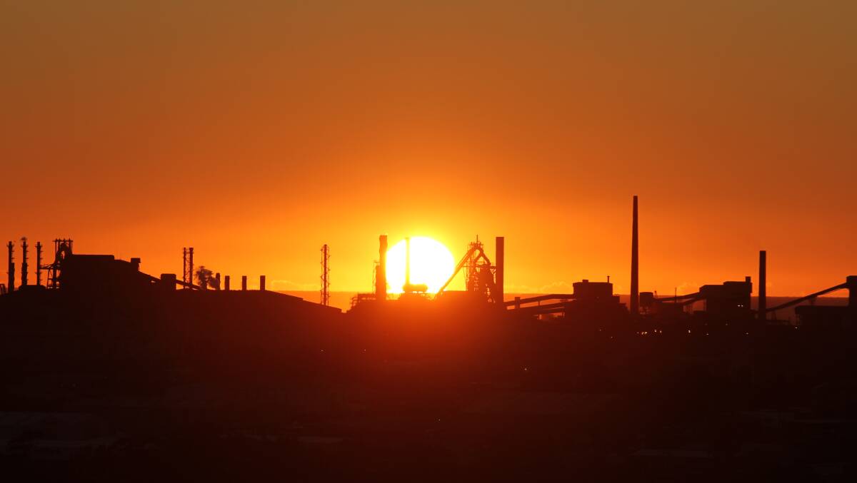 The sun rising over the No.6 blast furnace at Port Kembla.