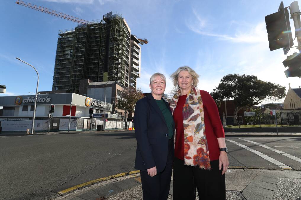 The Housing Trust's new CEO Amanda Winks and new managing director Michele Adair in front of the soon-to-be-completed Northsea apartment building. Picture by Robert Peet