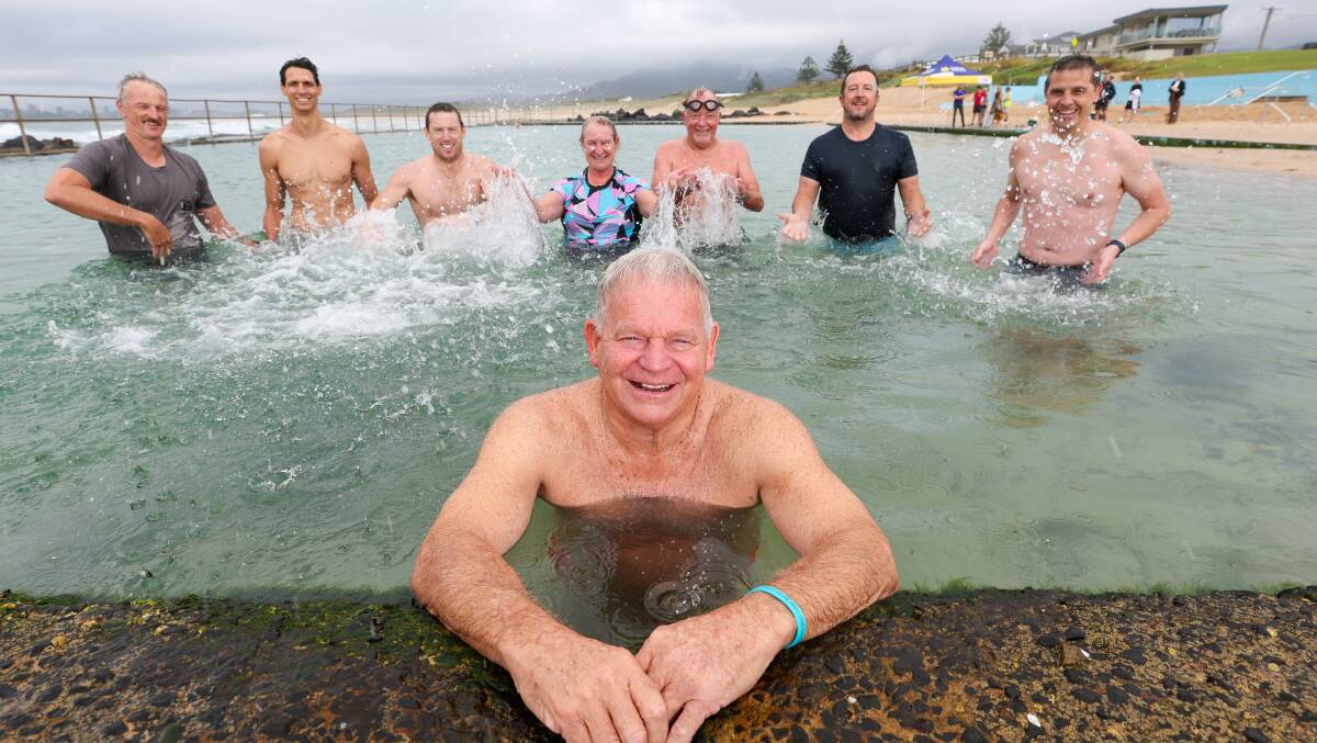Great Ocean Pool Crawl organiser Phil Murray, front, with supporters at Towradgi Rock Pool. Picture by Adam McLean