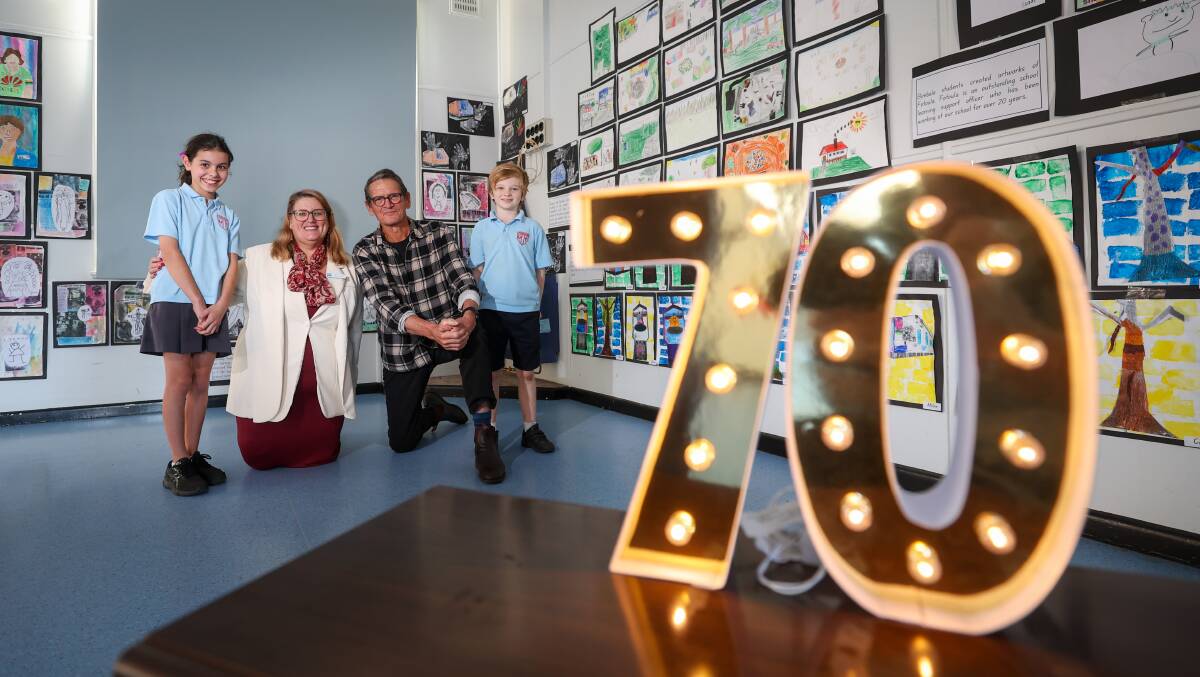 Towradgi Public School principal Jacqui Cavill and former student Albert Moerman with year five student Audrey Vecovski and year three student Cargo McKenna. Picture by Adam McLean