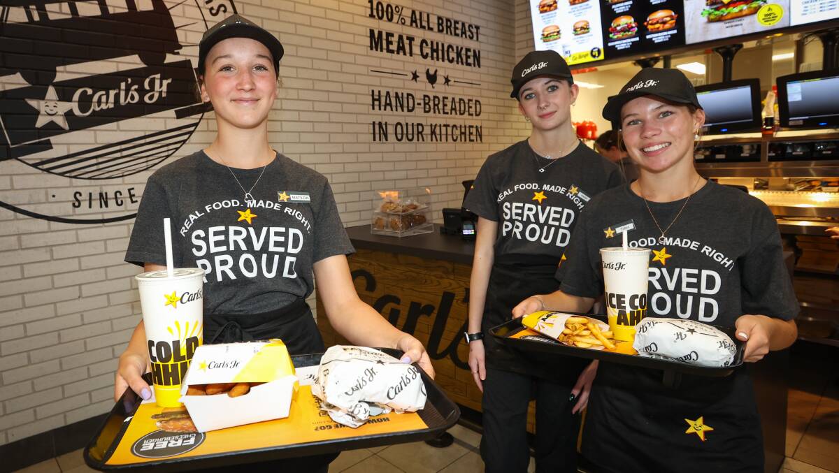 Carl's Jr Warrawong staff members Matilda Brooks, Paige Gorman and Tiah Russell. Picture by Wesley Lonergan