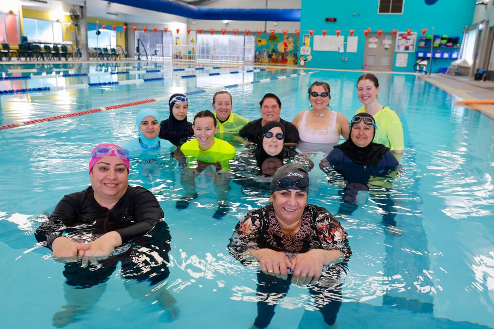 Some of the women involved in the program with instructors at McKeon's Swim School. Picture by Anna Warr