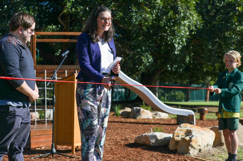 Former school captain Katelin McInerney cuts the ribbon on the new nature playground. Picture by Adam McLean
