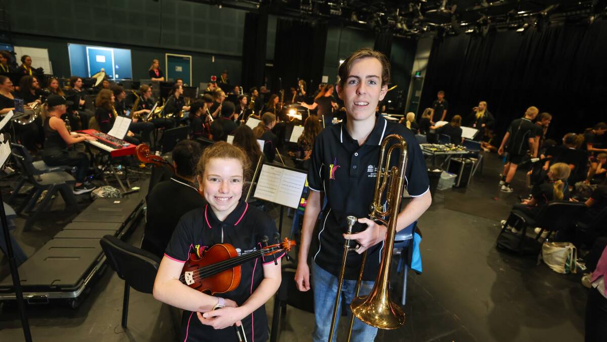 Violinist Polly Russo, 11, and trombonist Ethan Hales, 16, are in the Southern Stars orchestra. Picture by Adam McLean