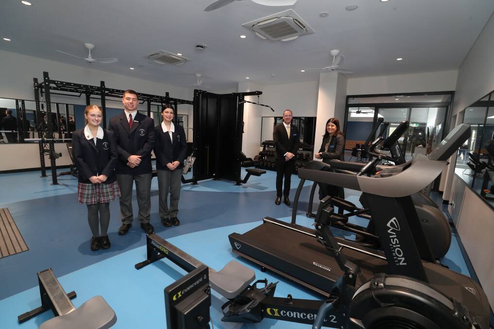 Holy Spirit College captains Eva Georgievski, Jackson Smith and Tallulah Rogers with principal Christopher Agnew and assistant principal Lisa Costabile in the new gym. Picture by Robert Peet