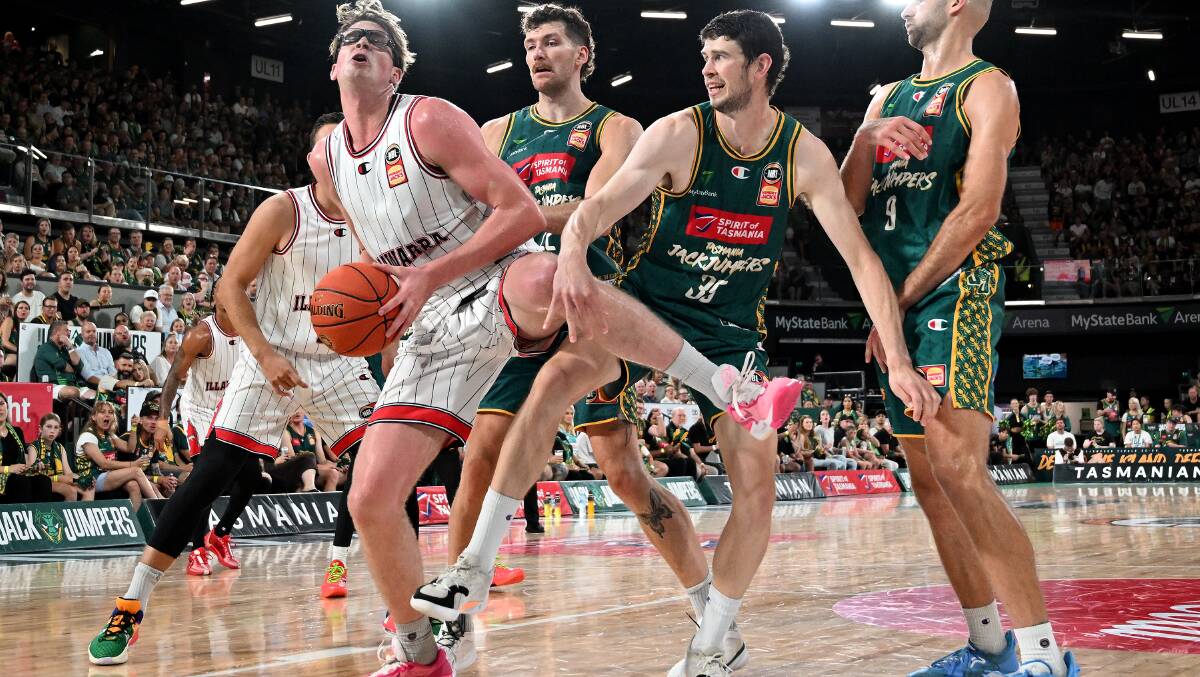 Clint Steindl of the Tasmania Jackjumpers tries to defend Illawarra Hawks centre Lachlan Olbrich during their NBL Seeding Qualifier at MyState Bank Arena on February 28, 2024. Picture by Steve Bell/Getty Images