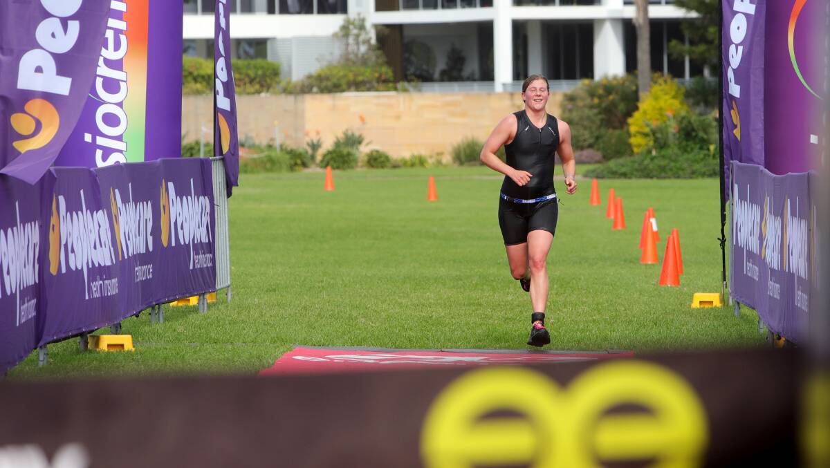 Zoe Clarke from Canberra won the women's triathlon. Picture by Sylvia Liber