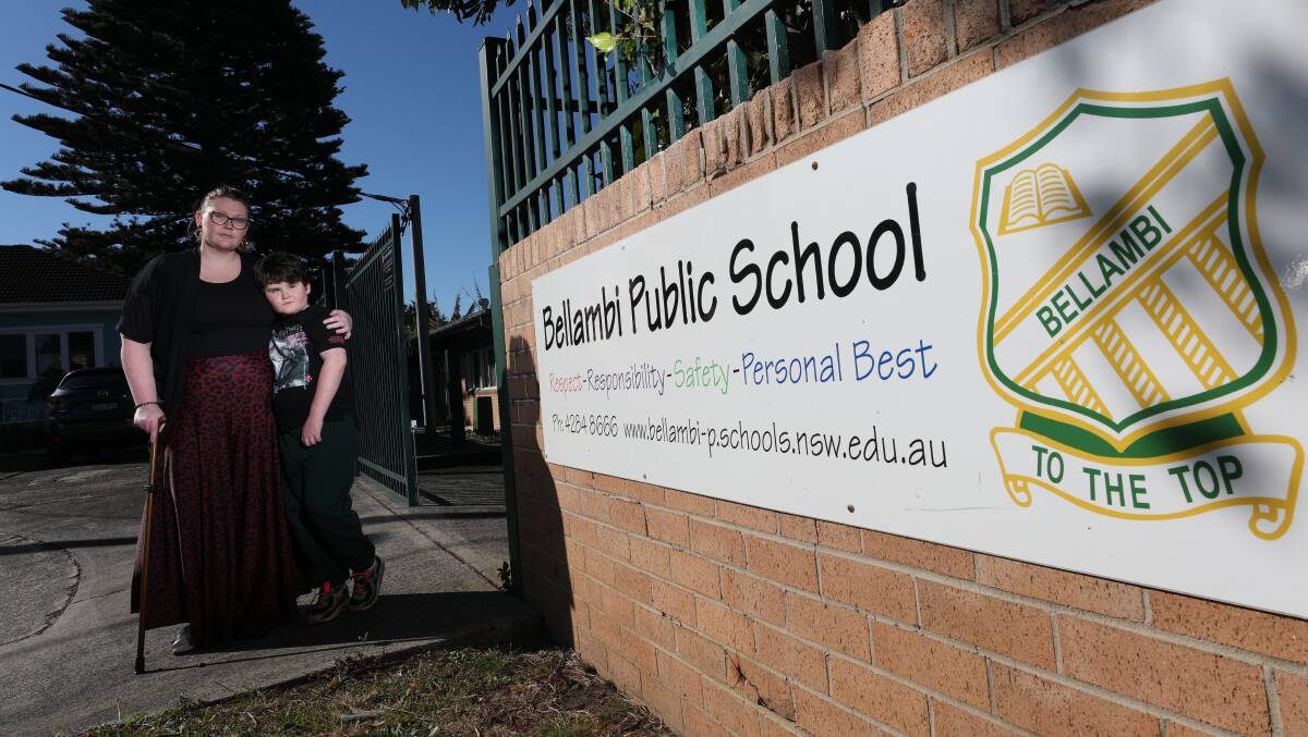 NOT HAPPY: Katie Hopkinson and her eight-year-old son Samson outside the ASPECT South Coast satellite school at Bellambi Public School, which closes at the end of the year. Picture: Adam McLean