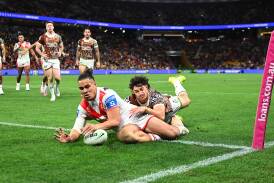  Christian Tuipulotu scoring one of his three tries he scored for St George Illawarra in the Dragons 30-26 win over Brisbane Broncos at Suncorp Stadium on Saturday, July 13, 2024. Picture by Albert Perez/Getty Images