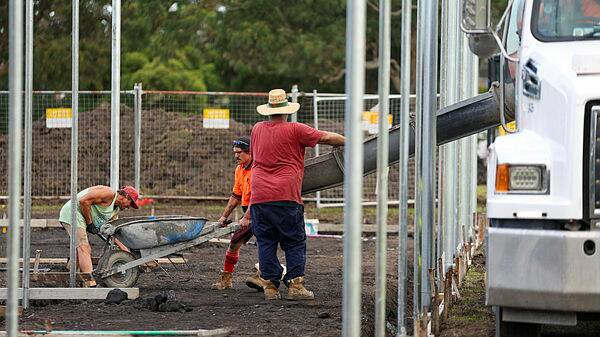 Workers pour concrete for the new nets at Hollymount Park in Woonona. Picture by Adam Mclean