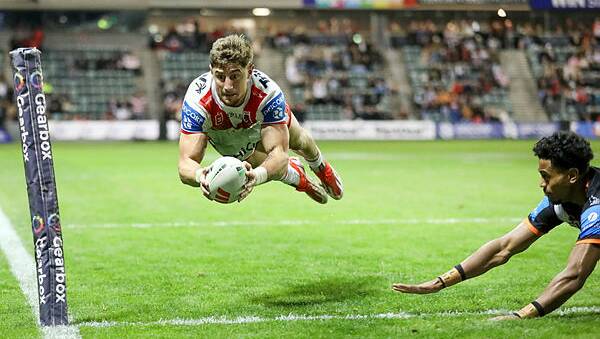 St George Illawarra Dragons winger Zac Lomax dives over for a try in his team's big win over Wests Tigers at WIN Stadium on Friday night. Picture by Adam McLean