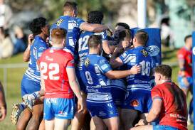 Thirroul players celebrate scoring a try against Wests Devils at Thomas Gibson Park in 2023. Picture by Anna Warr 