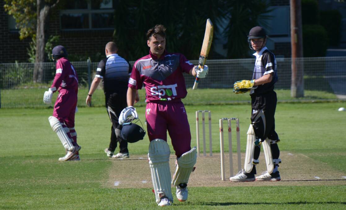 Ethan Debono raises his bat after smashing a century for Illawarra in their Creighton Cup victory over South Coast. Picture supplied