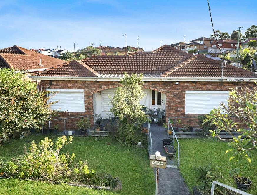 The three-bedroom home at 121 Cowper Street, Warrawong sold under the hammer. 
