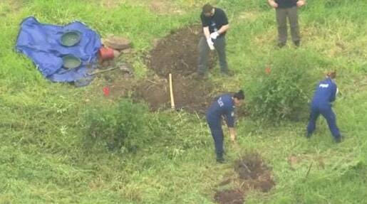 Aerial footage of the remote property shows police digging. Photo: 7 News