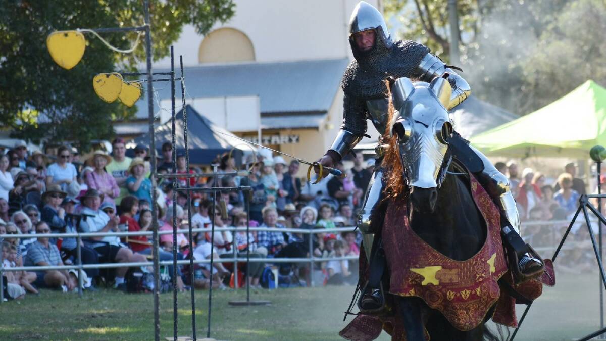 A jousting knight riding a horse at the Berry Celtic Festival. 