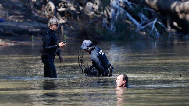 Police search the Murray for the boy. Photo: Luke Hemer/Riverine Herald
