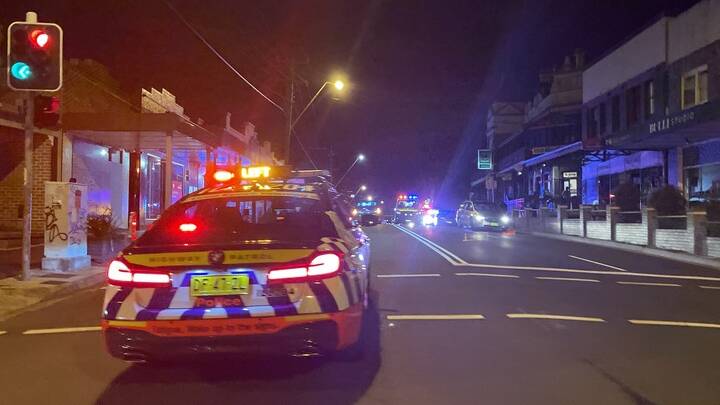 Police block the Princes Highway at Bulli as patients are treated by paramedics. Picture supplied