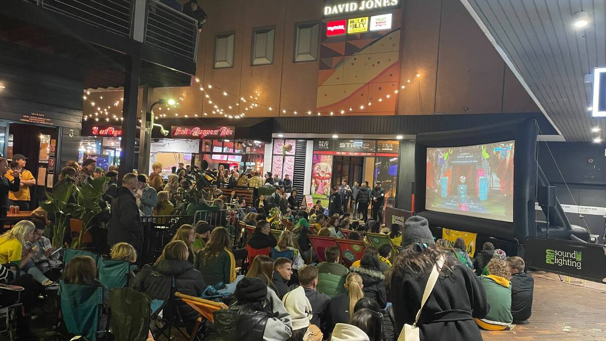 Matildas fans gather in Globe Lane in Wollongong on Wednesday night. Picture by Marlene Even
