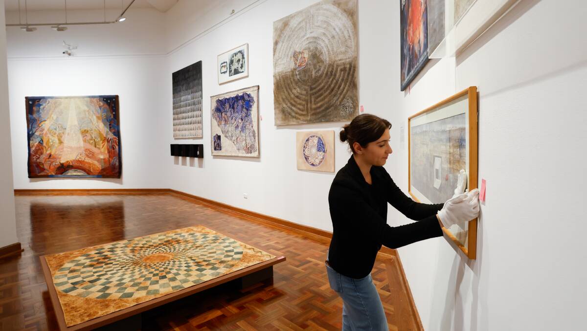 Installers put the finishing touches on Diana Wood Conroy's new exhibition at Wollongong Art Gallery. 