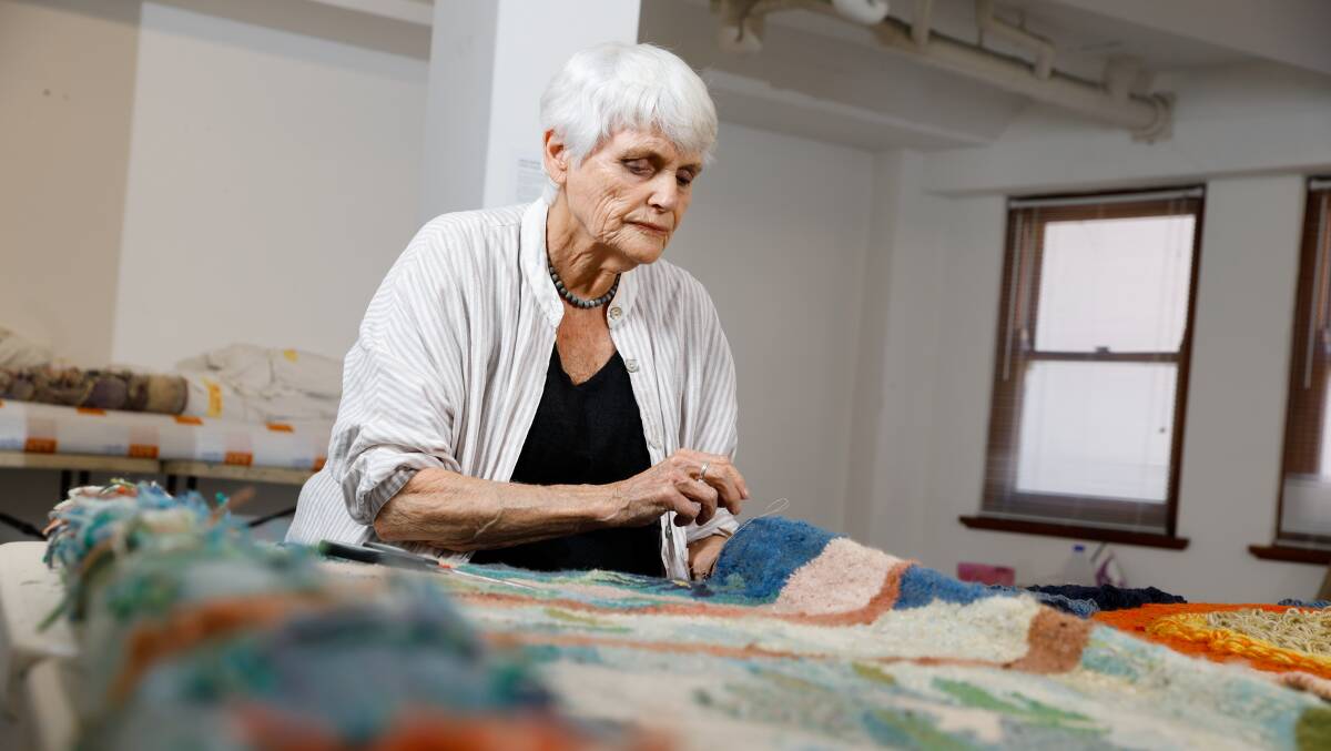 Diana Wood Conroy works on restoring old tapestries before her exhibition at Wollongong Art Gallery. Pictures by Anna Warr