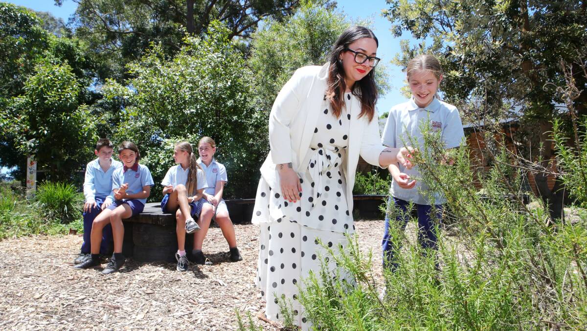 Tarrawanna PS assistant principal Sarah Martin with students in the sensory garden. Pictures by Sylvia Liber