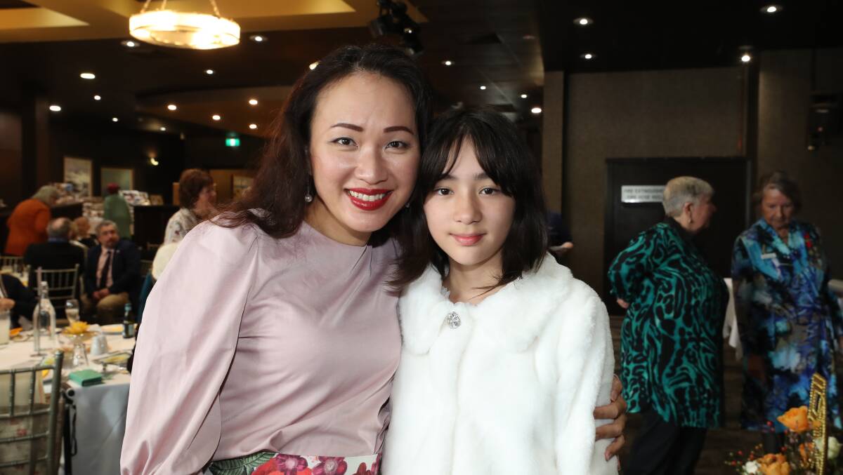 Esther Hernandez and her daughter Sophia, who is the youngest member of the Illawarra Rose Society. 