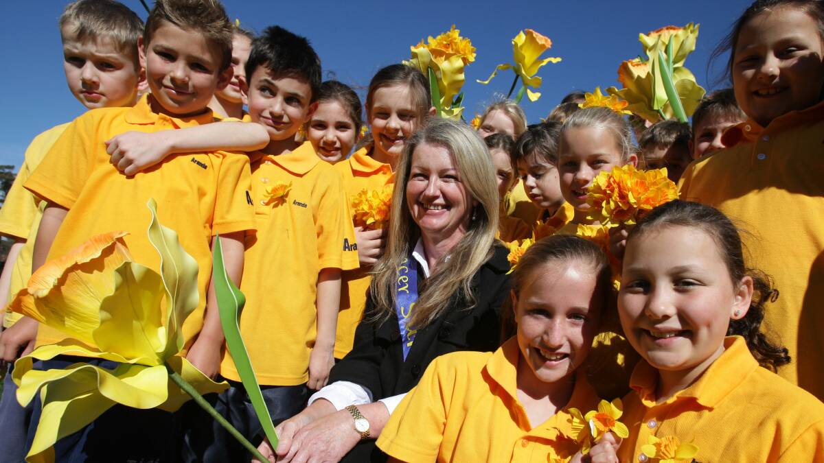 TIGS deputy Monica Watt with students marking Daffodil Day in 2008. Picture by Melanie Russell